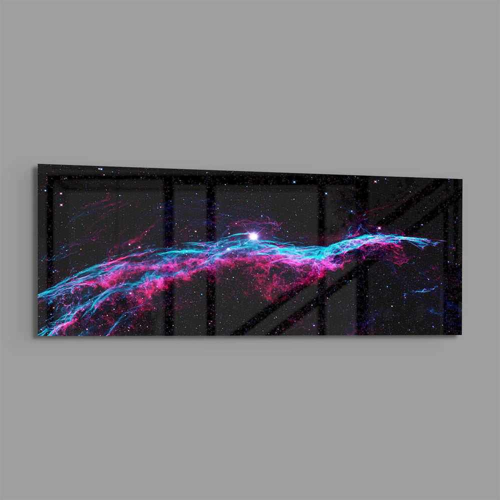 A vivid deep-space nebula with pink and turquoise gas filaments stretching across a starry black sky. panoramic glass wall art E