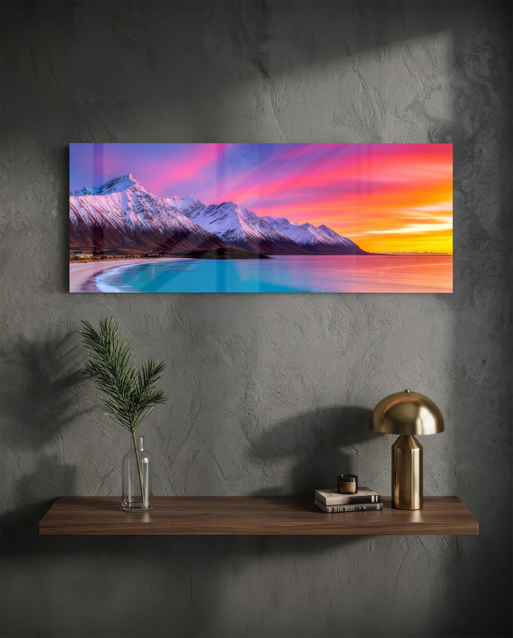 Snow-capped mountains under a vivid pink and orange twilight sky above a turquoise curving shoreline. panoramic glass wall art D