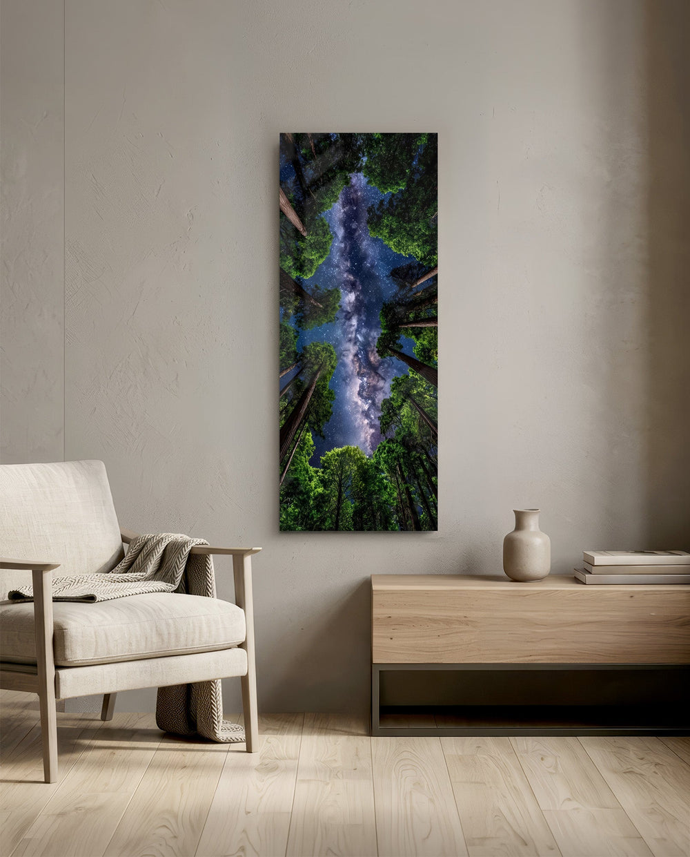 Upward view through towering forest trees to a glowing Milky Way in a star-filled sky. panoramic glass wall art F