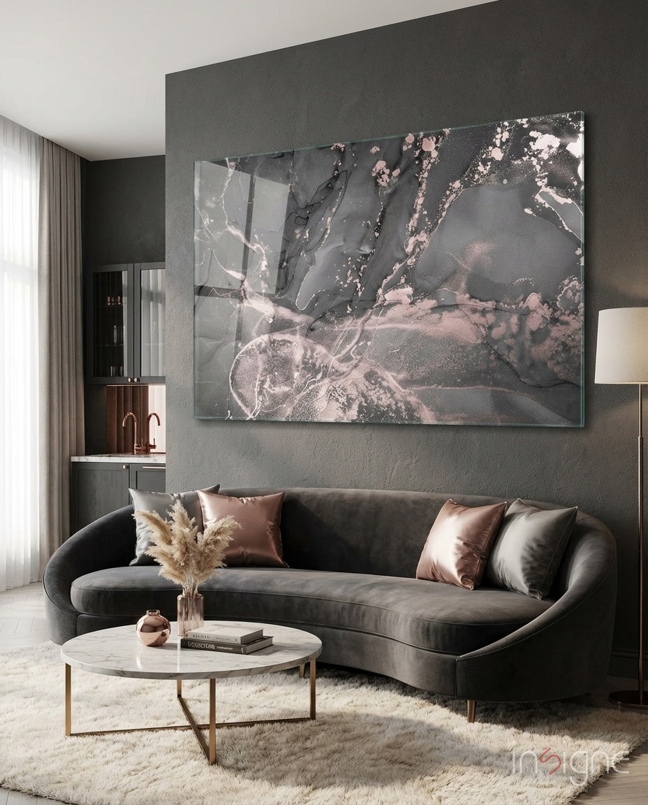 Smoke and Blush glass wall art displayed above a curved grey velvet sofa in a charcoal-walled lounge