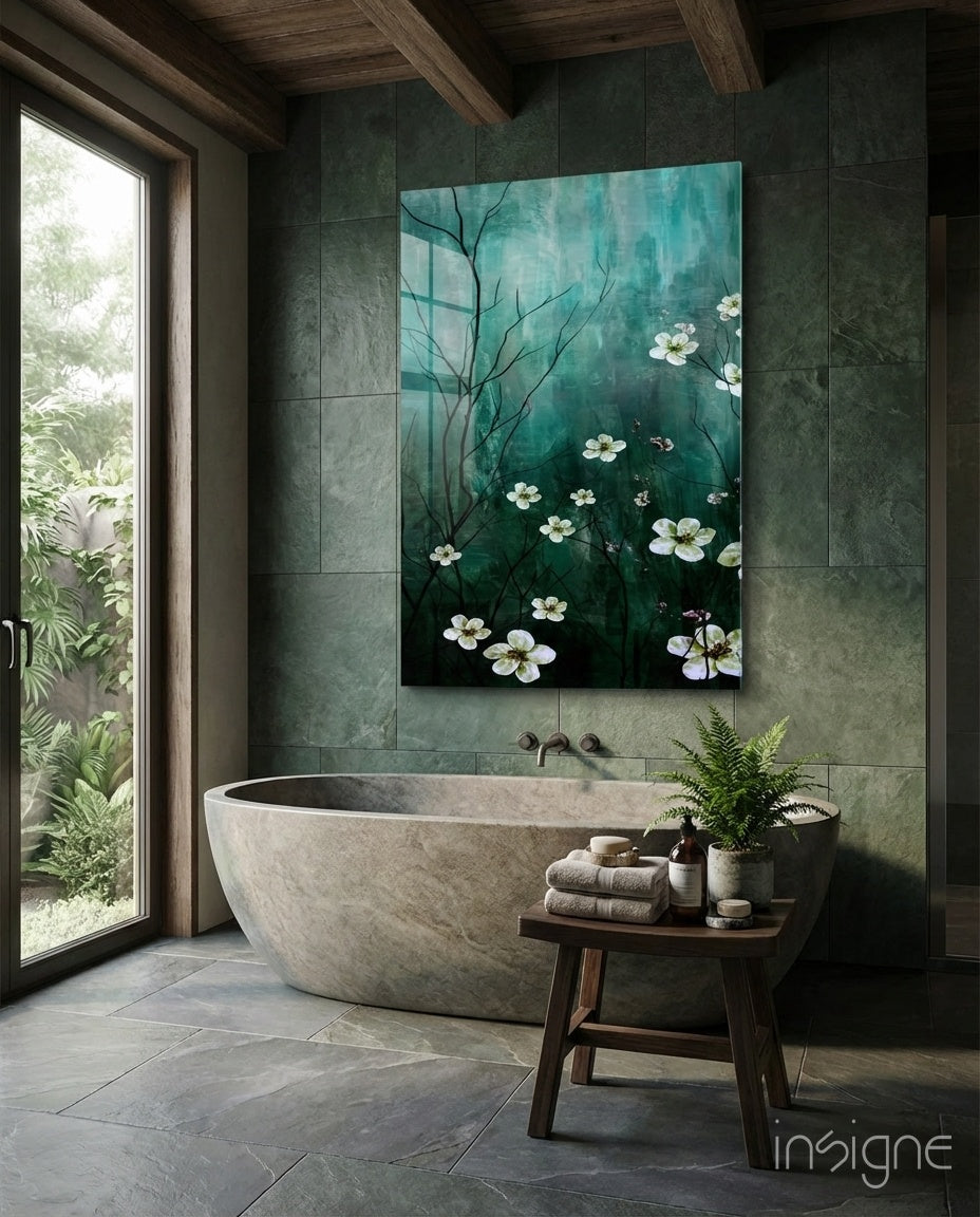Emerald Daisies glass wall art displayed above a stone tub in a green-tile bathroom with garden view