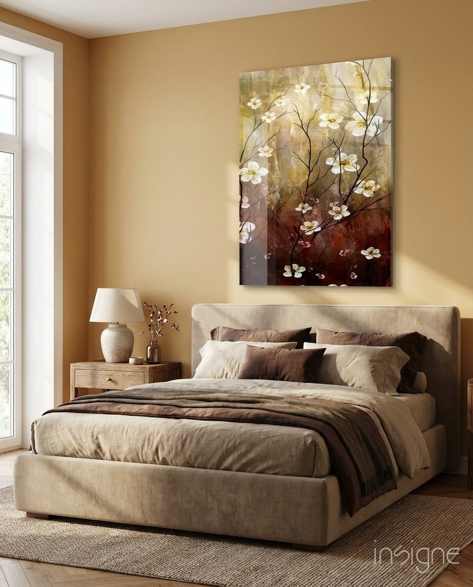 Amber Daisies glass wall art displayed above an upholstered bed in a warm beige bedroom
