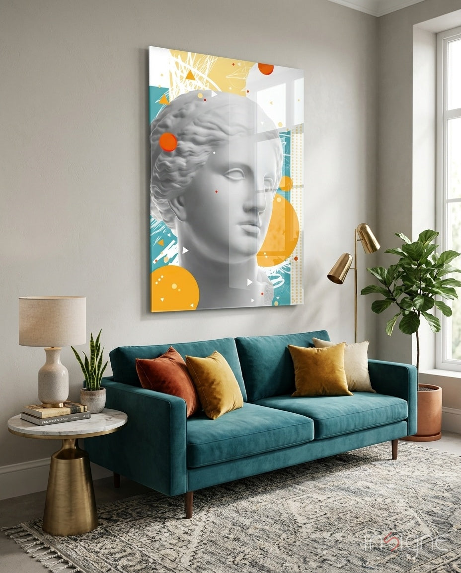 Venus Collage glass wall art displayed above a teal velvet sofa in a bright minimalist lounge