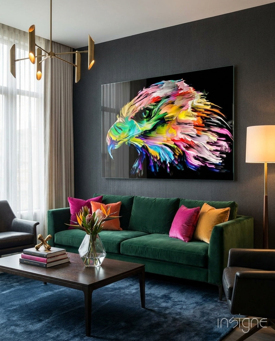 Vivid Eagle glass wall art displayed above an emerald velvet sofa in a charcoal lounge with brass chandelier