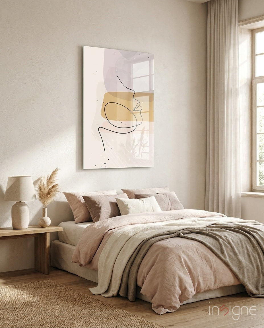 Mustard Line Portrait glass wall art displayed above a blush-linen bed in a warm beige bedroom