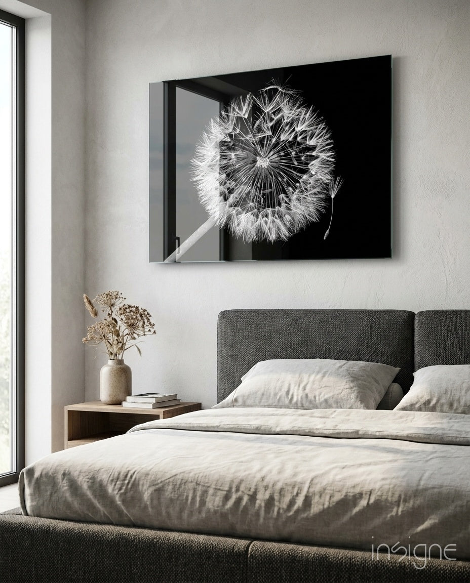Dandelion Wish glass wall art displayed above a charcoal upholstered headboard in a greige bedroom