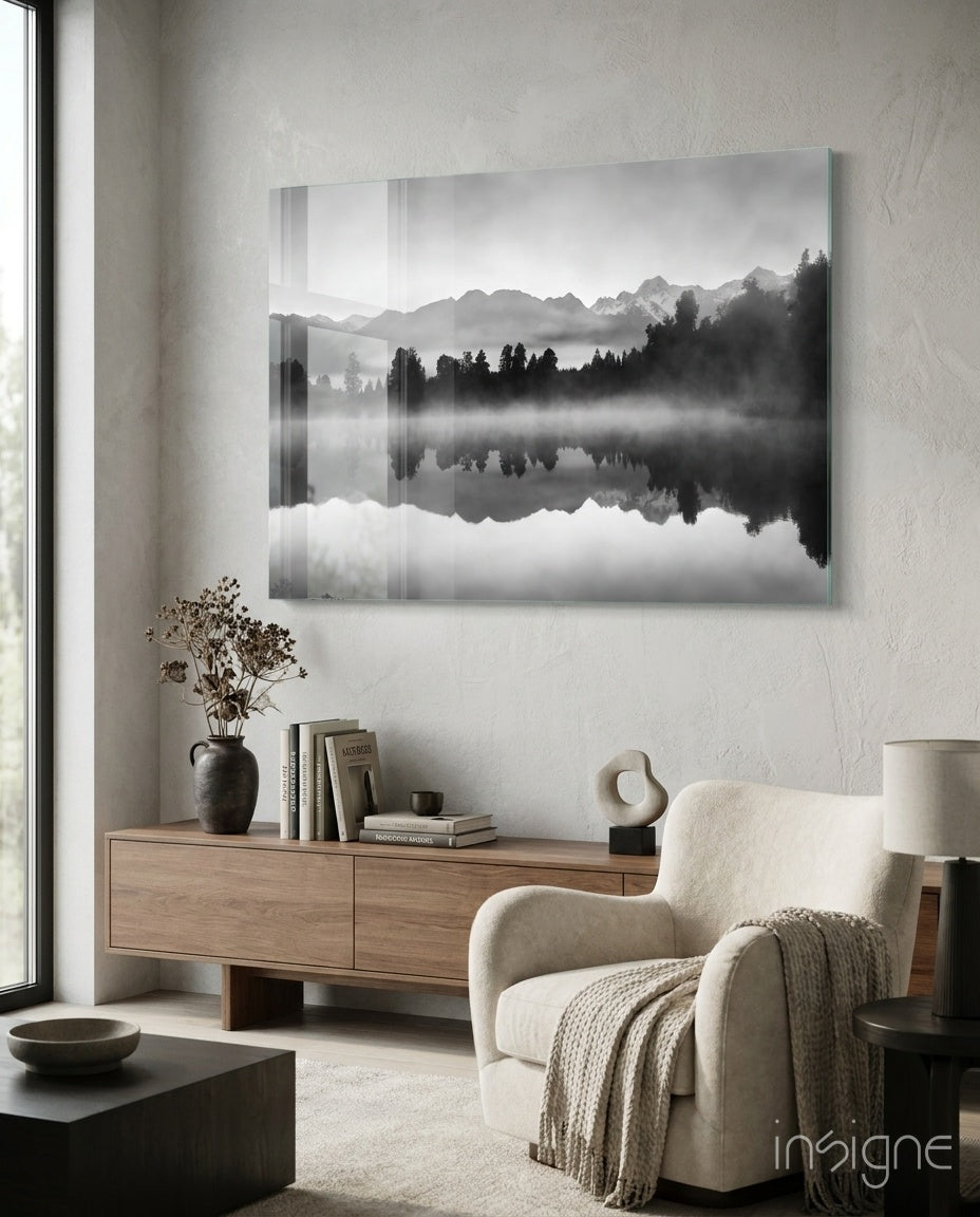 Misty Lake glass wall art displayed above a wood low credenza in a warm beige minimalist lounge with bouclé chair