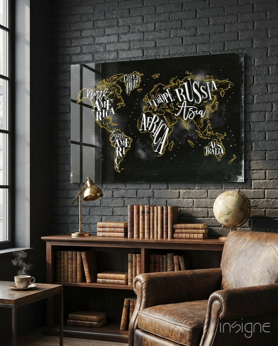 Modern World Map glass wall art displayed above a wood library shelf in a black brick-walled study with brass lamp and antique globe