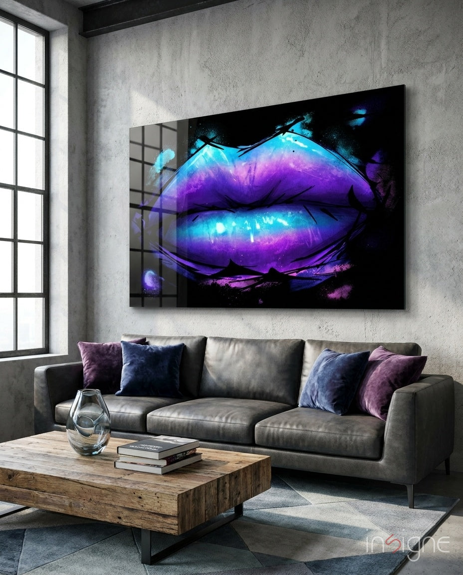 Lip glass wall art displayed above a gray leather sofa in a concrete-walled lounge with violet velvet pillows and reclaimed wood coffee table