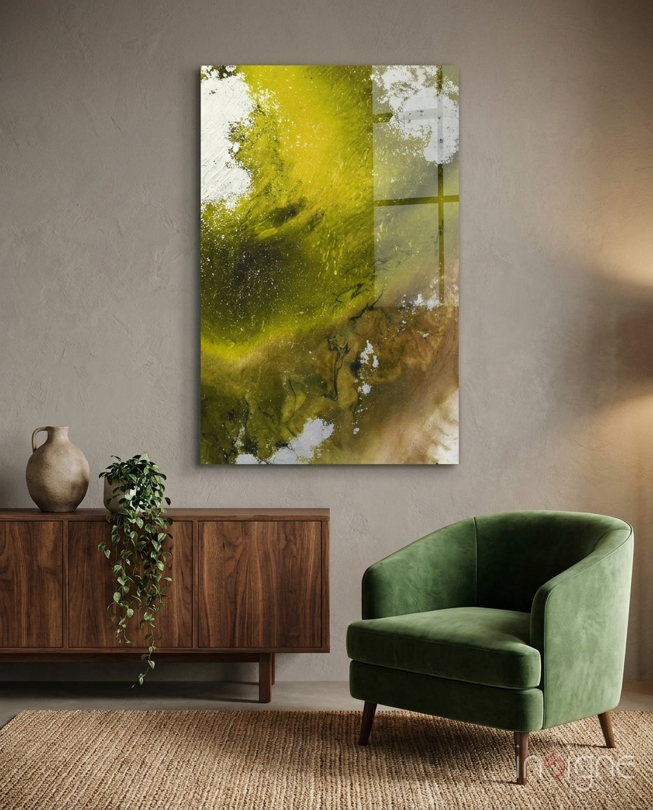 Colors of Abstraction glass wall art displayed beside a green velvet armchair in a soft taupe-walled lounge with walnut credenza and trailing pothos