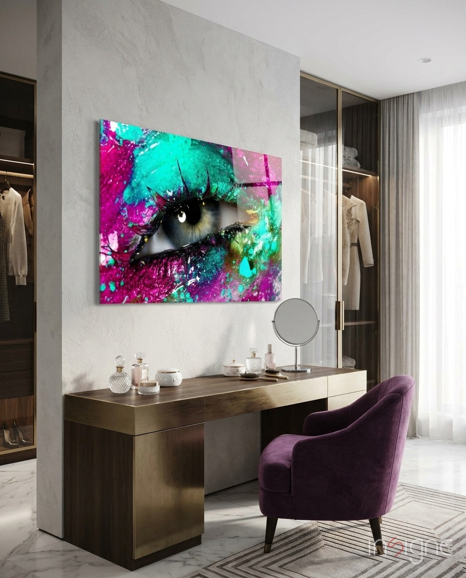 Pupil glass wall art displayed above a brass dressing table in a soft white-marble closet with plum velvet armchair and perfume bottles