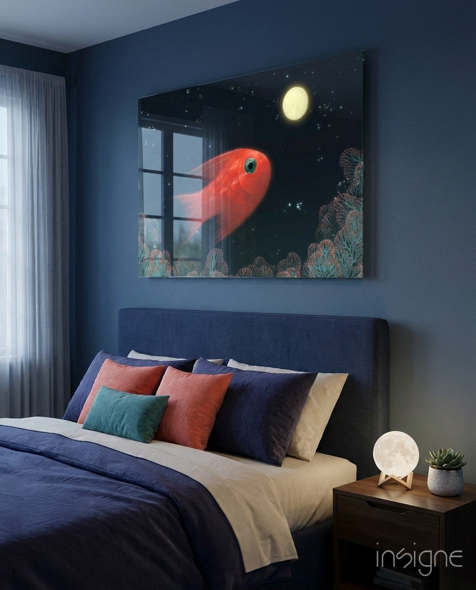 Fish glass wall art displayed above a navy upholstered bed in a deep blue-walled bedroom with coral velvet pillows and moon lamp