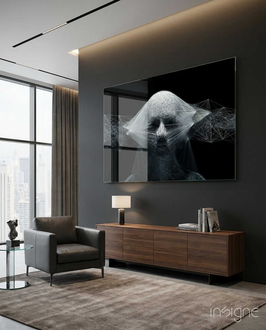 Self glass wall art displayed above a walnut credenza in a moody charcoal-walled lounge with leather armchair and city view