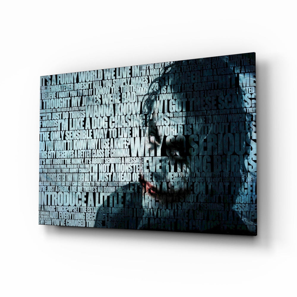 Joker glass wall art displayed above a black leather sectional in a moody home theater with brass arc lamp and reclaimed-wood console