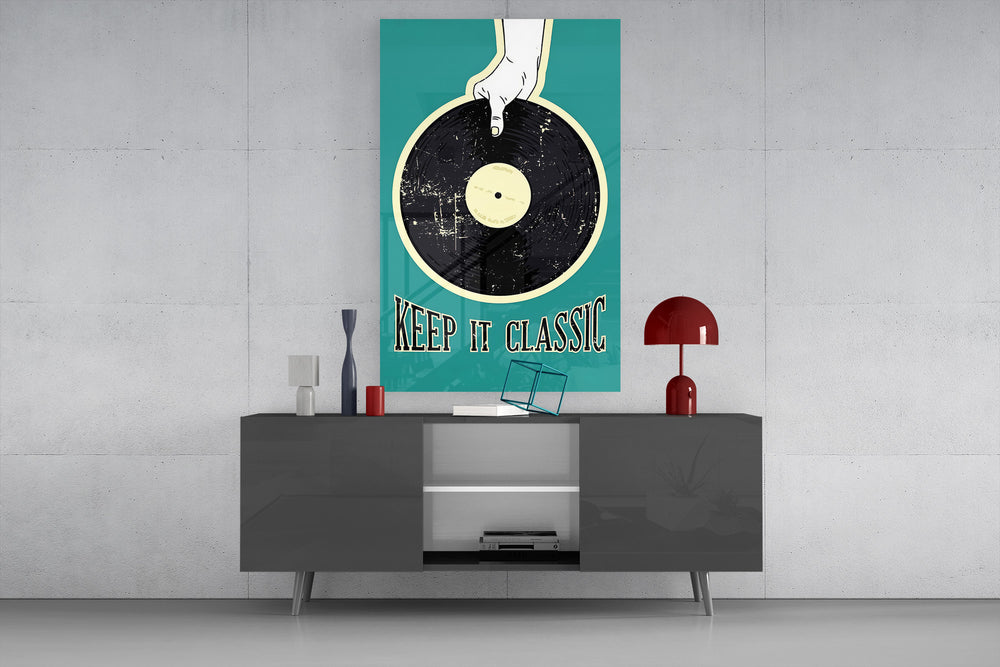 Keep It Classic teal glass wall art catching light to reveal its poster texture