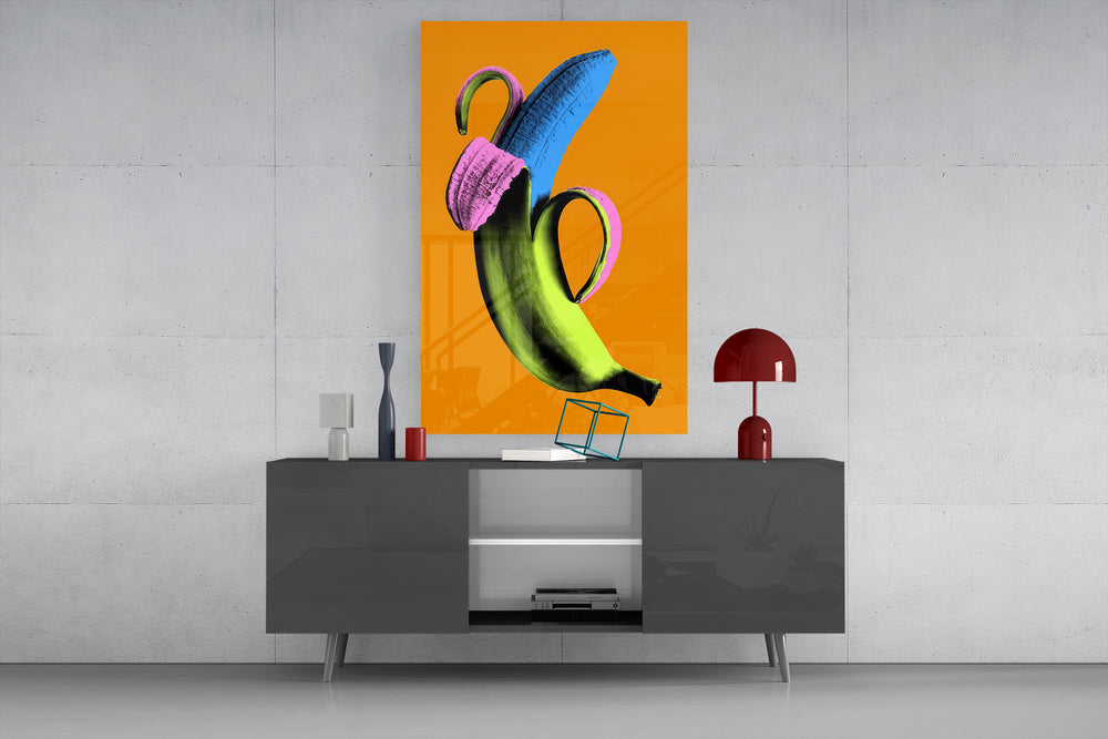 Pop banana glass wall art catching light to reveal its flat-color shapes