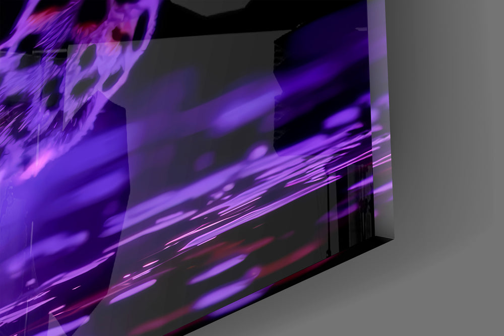 Close-up detail of the magenta-glowing leopard and reflective floor behind glass
