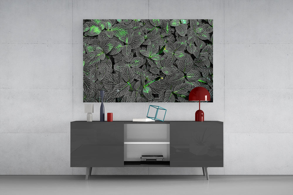 Luminous leaf glass wall art catching light to reveal its veined texture