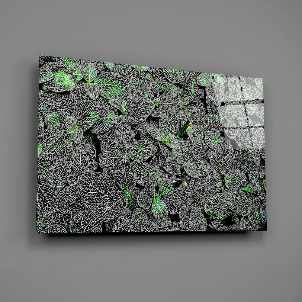 Dark foliage panel anchoring a hotel lobby wall