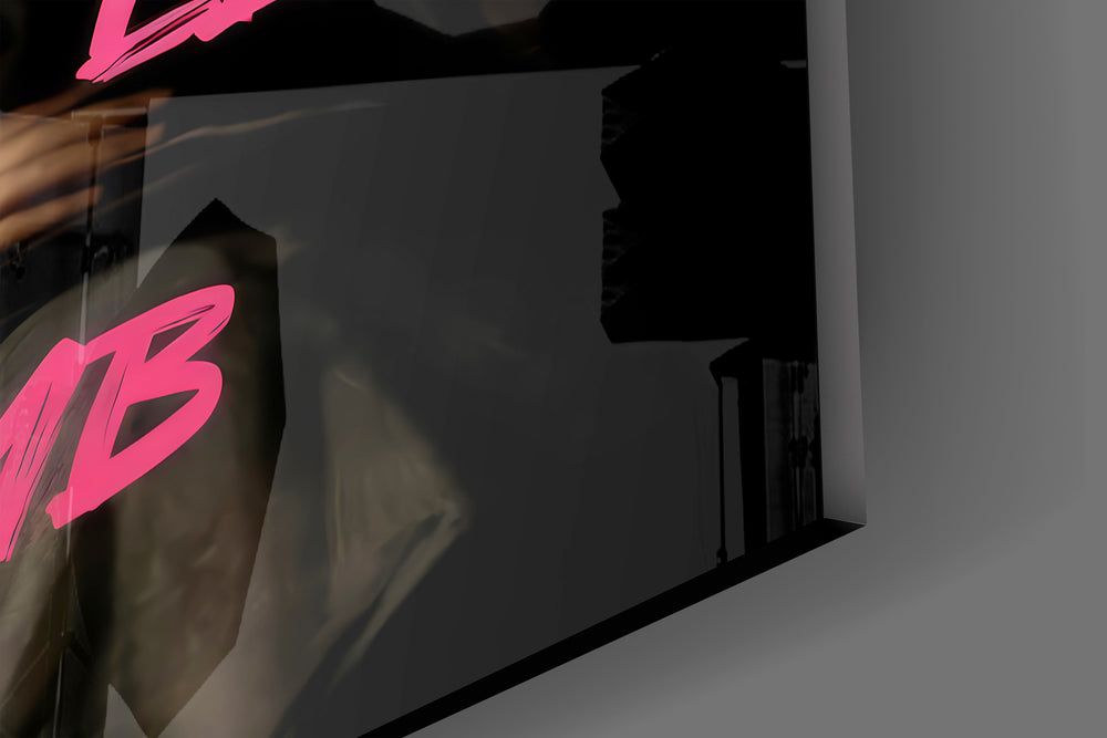 Close-up detail of the silk-gown portrait and magenta graffiti behind glass