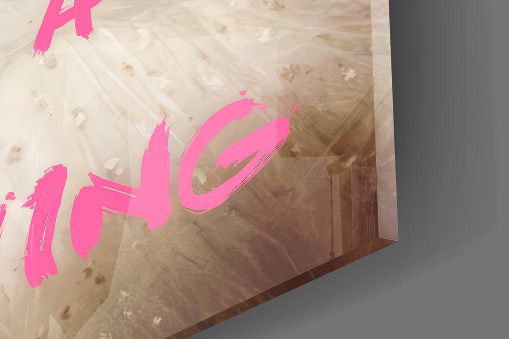 Close-up detail of the white-gown portrait and pink graffiti behind glass