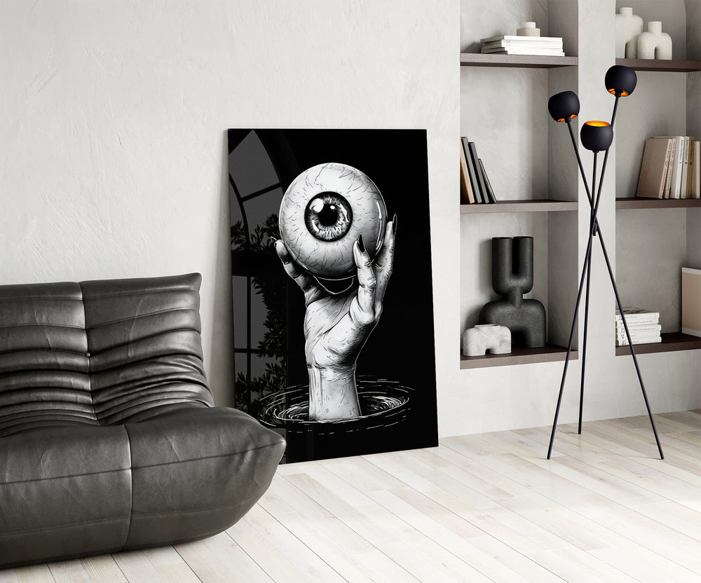 Eye-and-hand panel against a moody black-painted accent wall