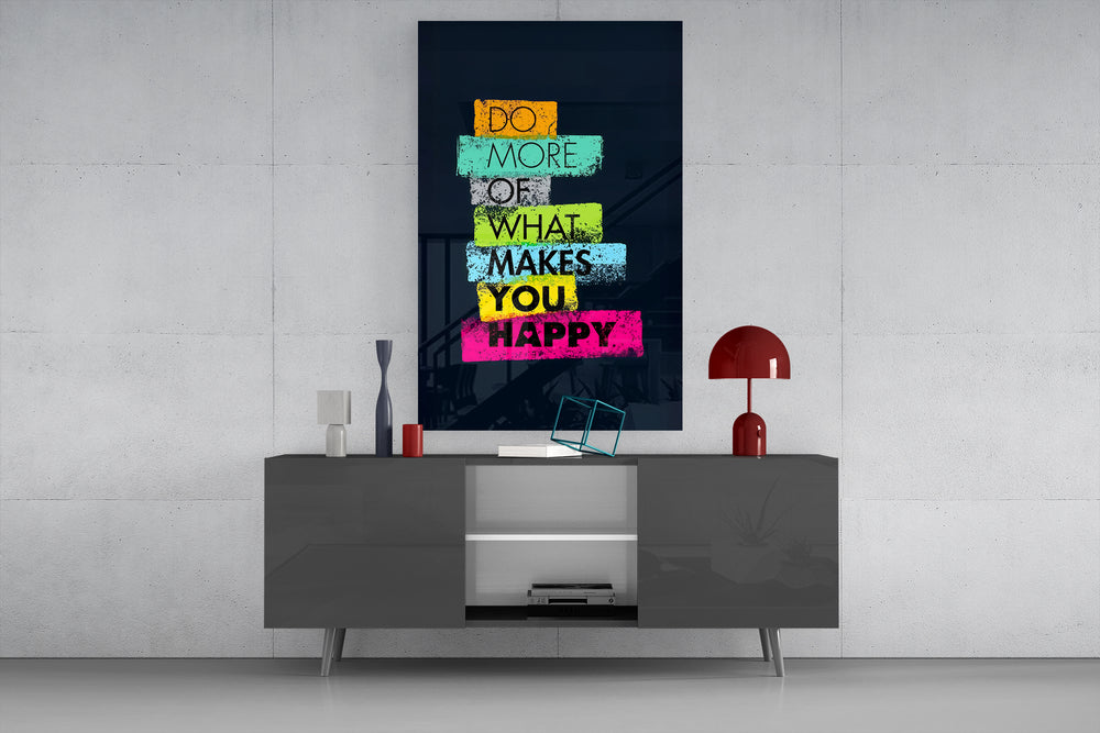 Do More Of What Makes You Happy glass wall art catching light to reveal its chalky edges