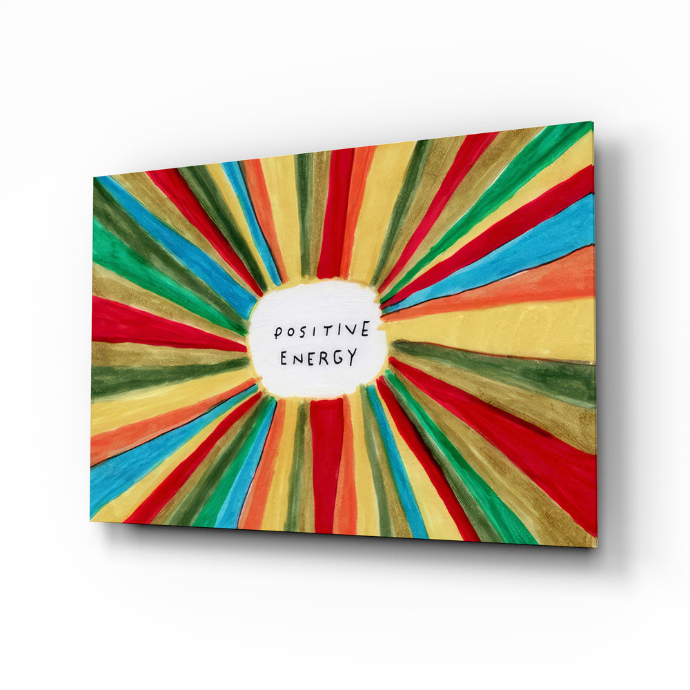Positive Energy horizontal sunburst glass wall art above a modern sofa