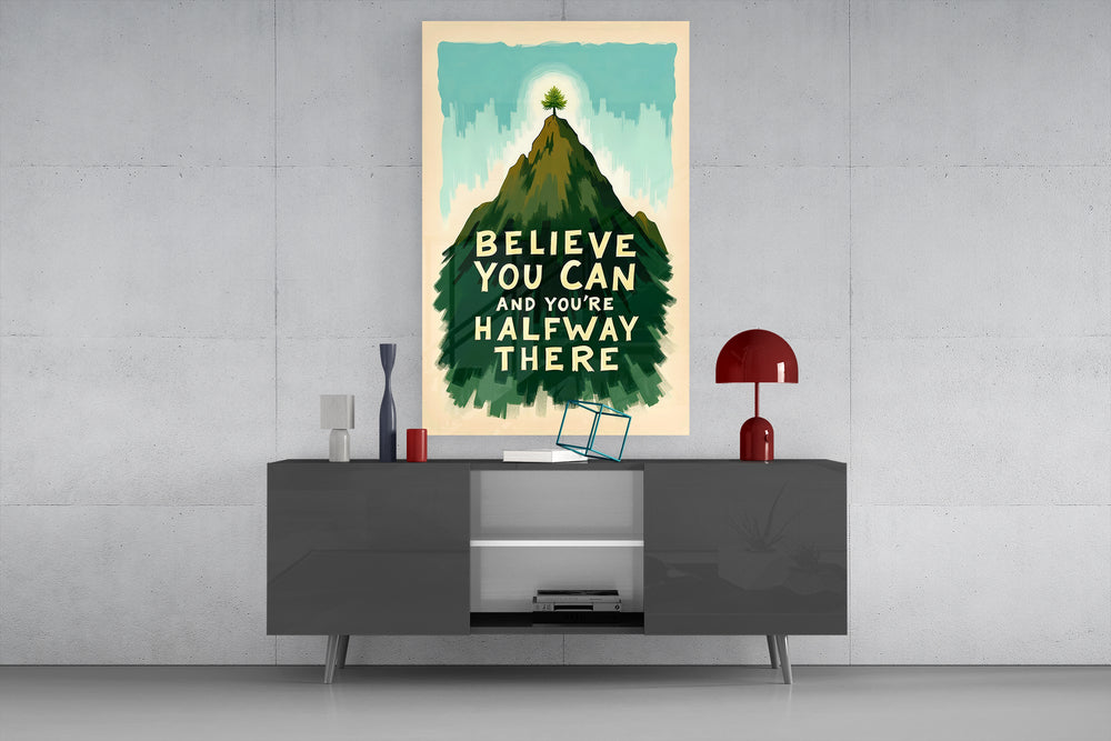 Believe You Can glass wall art catching light to reveal its painted brushwork