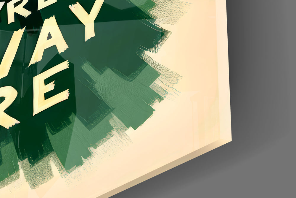 Close-up detail of the painted summit and hand-lettered typography behind glass