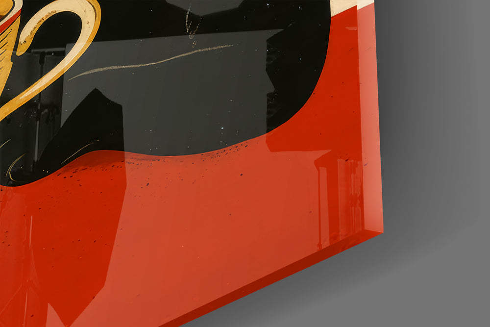 Close-up detail of the black cat and steaming coffee cup behind glass