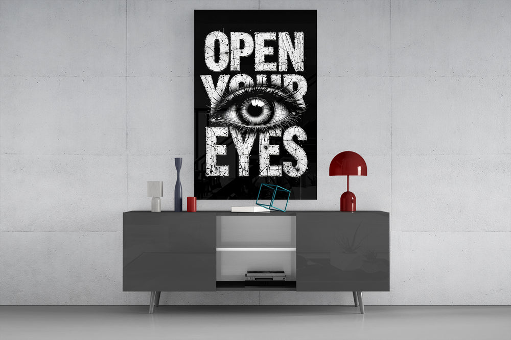 Open Your Eyes glass wall art catching light to reveal its inked texture