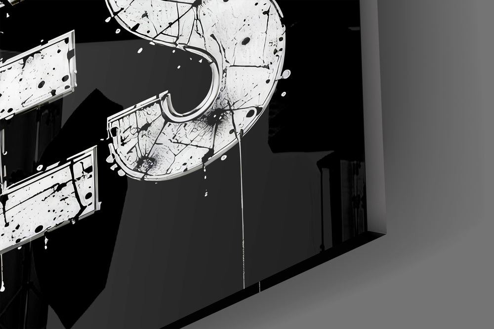 Close-up detail of the inked typography and detailed eye behind glass