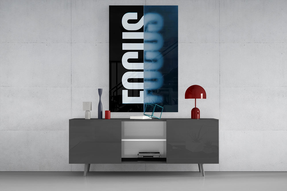 Focus glass wall art catching light to reveal its split-typography clarity