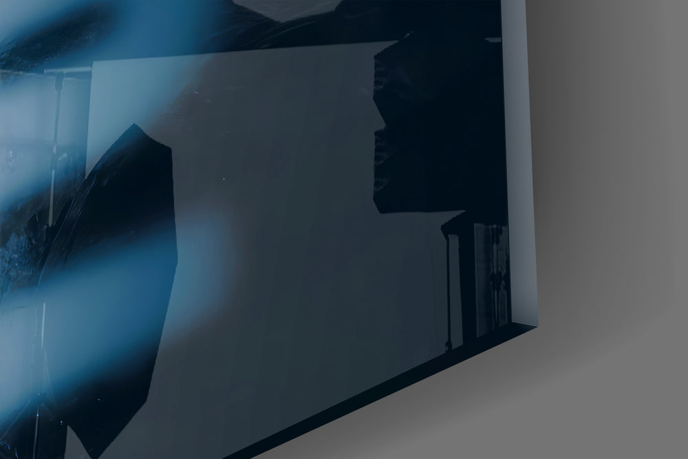 Close-up detail of the sharp ivory and blurred blue typography behind glass