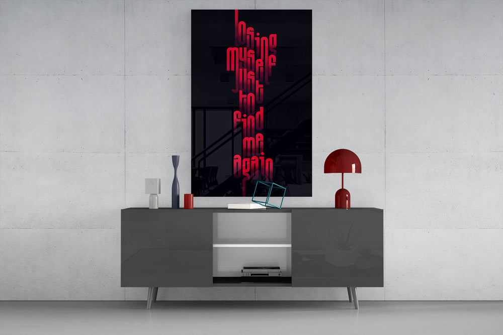 Lost Myself glass wall art catching light to reveal its condensed letterforms