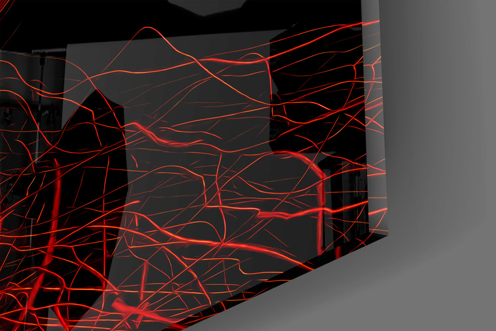 Close-up detail of the tangled scarlet threads behind glass