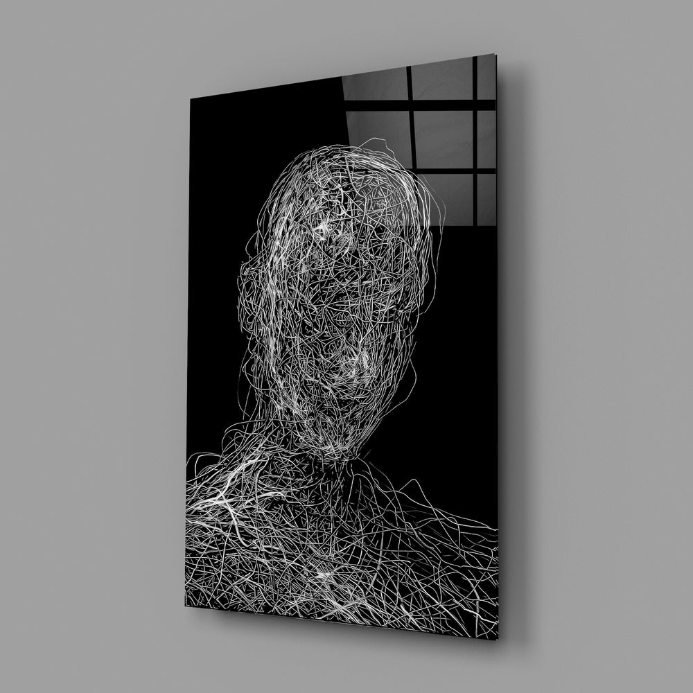 Conceptual portrait panel anchoring a designer's office wall