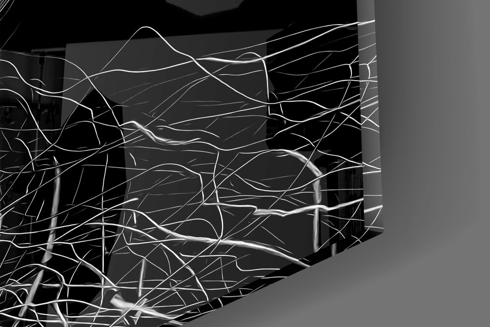 Close-up detail of the tangled white threads behind glass