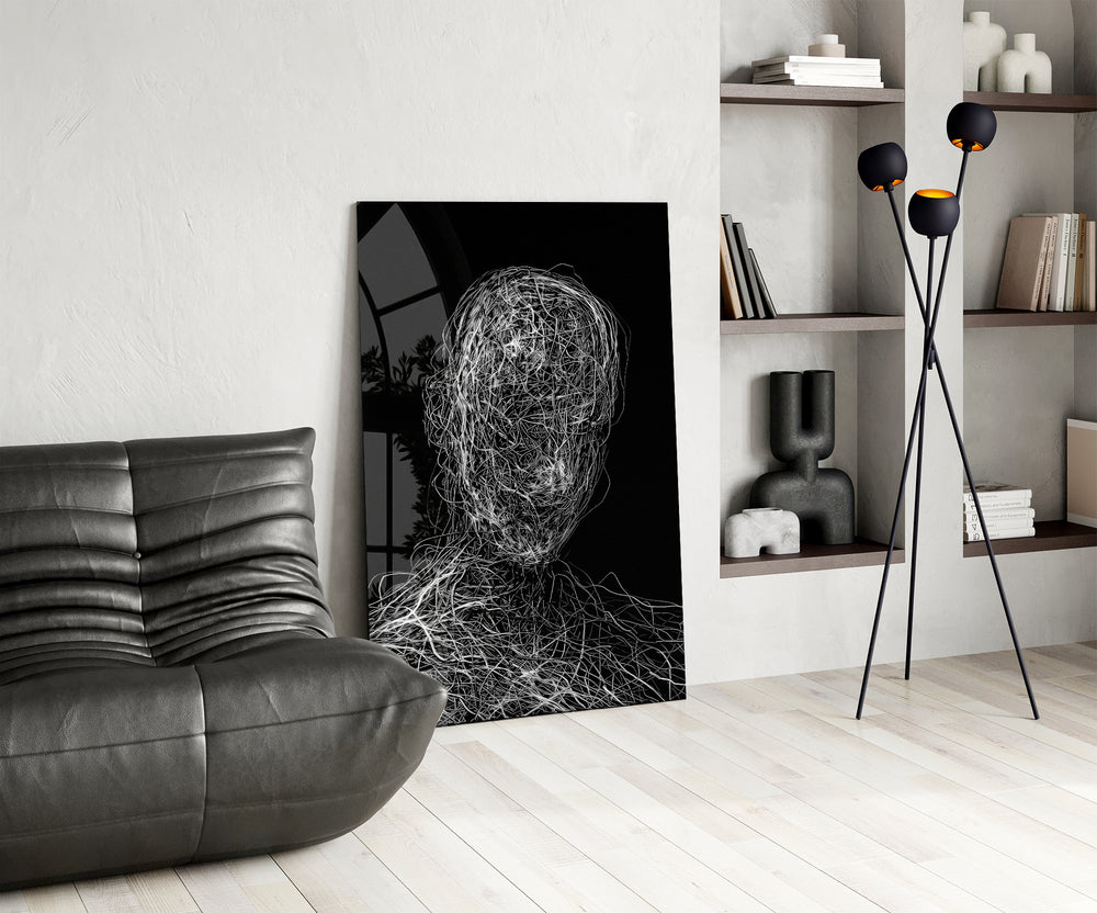 Threaded-portrait panel against a moody black-painted accent wall