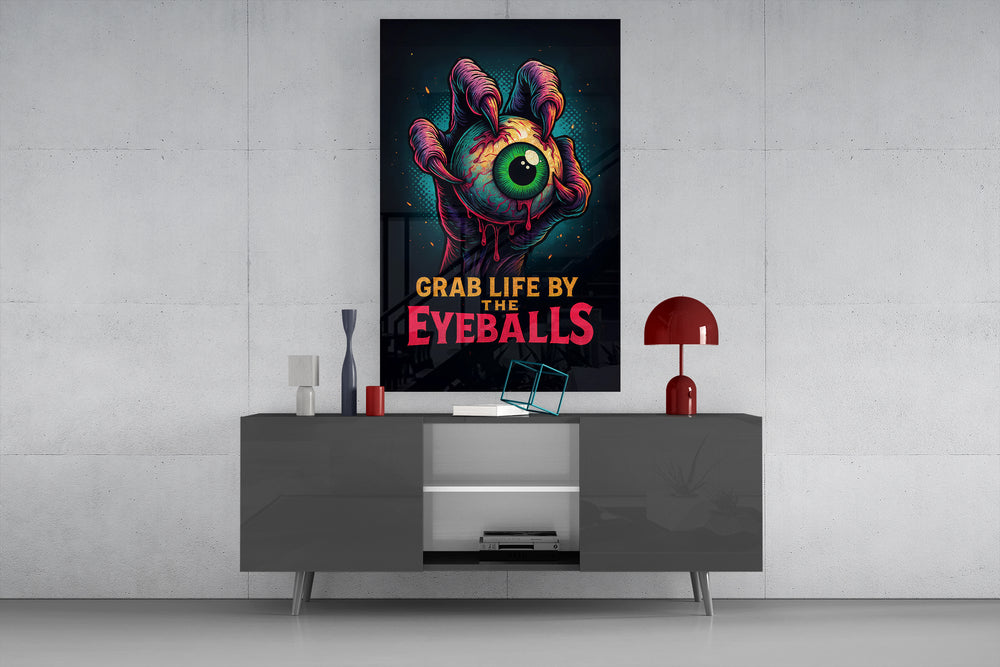Grab Life By The Eyeballs glass wall art catching light to reveal its halftone dots