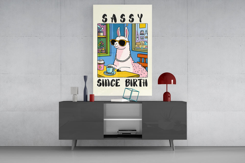 Sassy Since Birth glass wall art catching light to reveal its cartoon line work