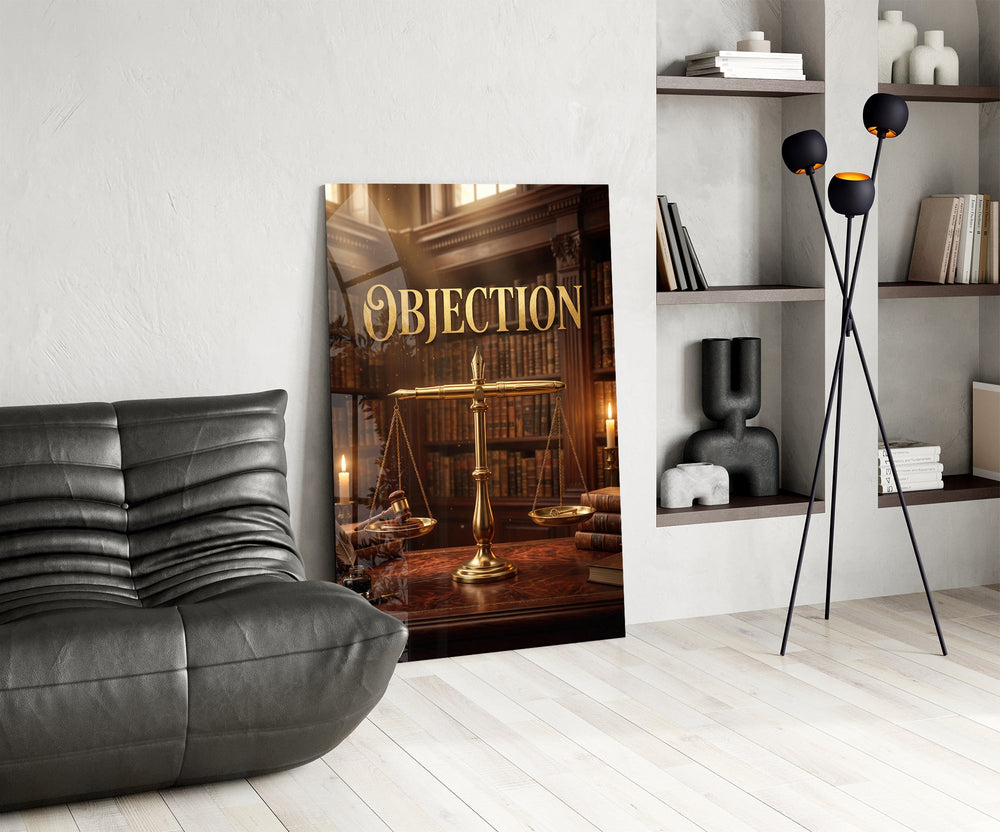 Objection glass wall art leaning beside a dark leather sofa in a study