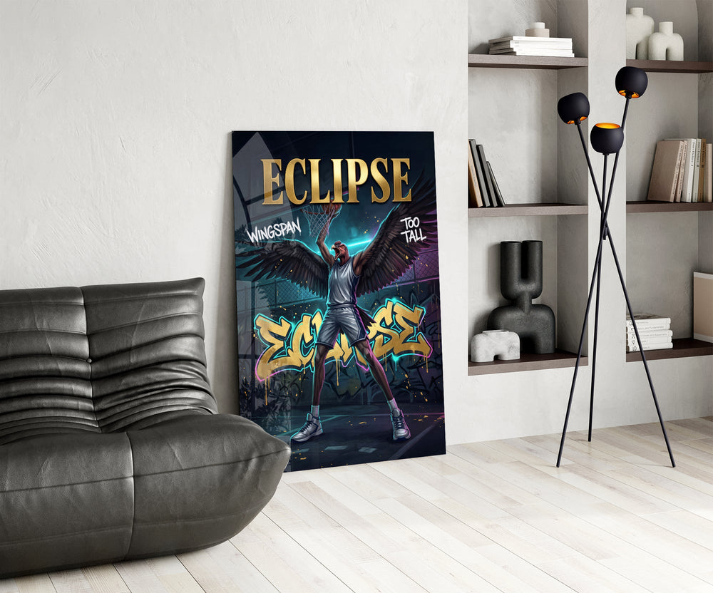 eclipse black-winged raptor baller glass wall art leaning beside a dark leather sofa