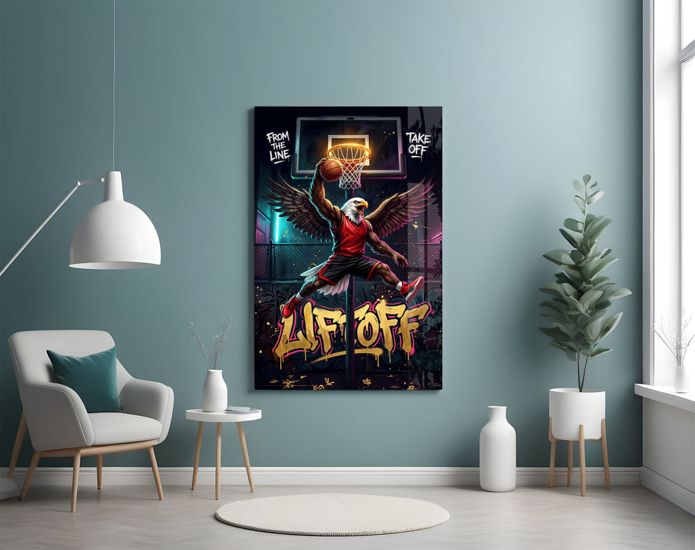 eagle basketball player dunking glass wall art styled above an armchair in a reading corner
