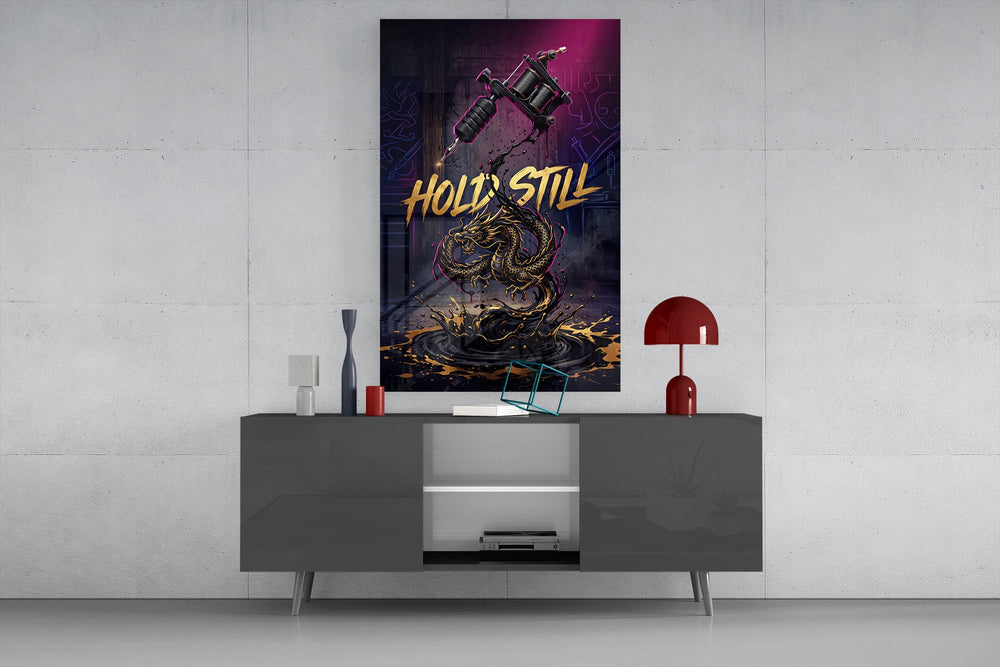 hold still tattoo machine and gold dragon glass wall art displayed above a console in a designer interior