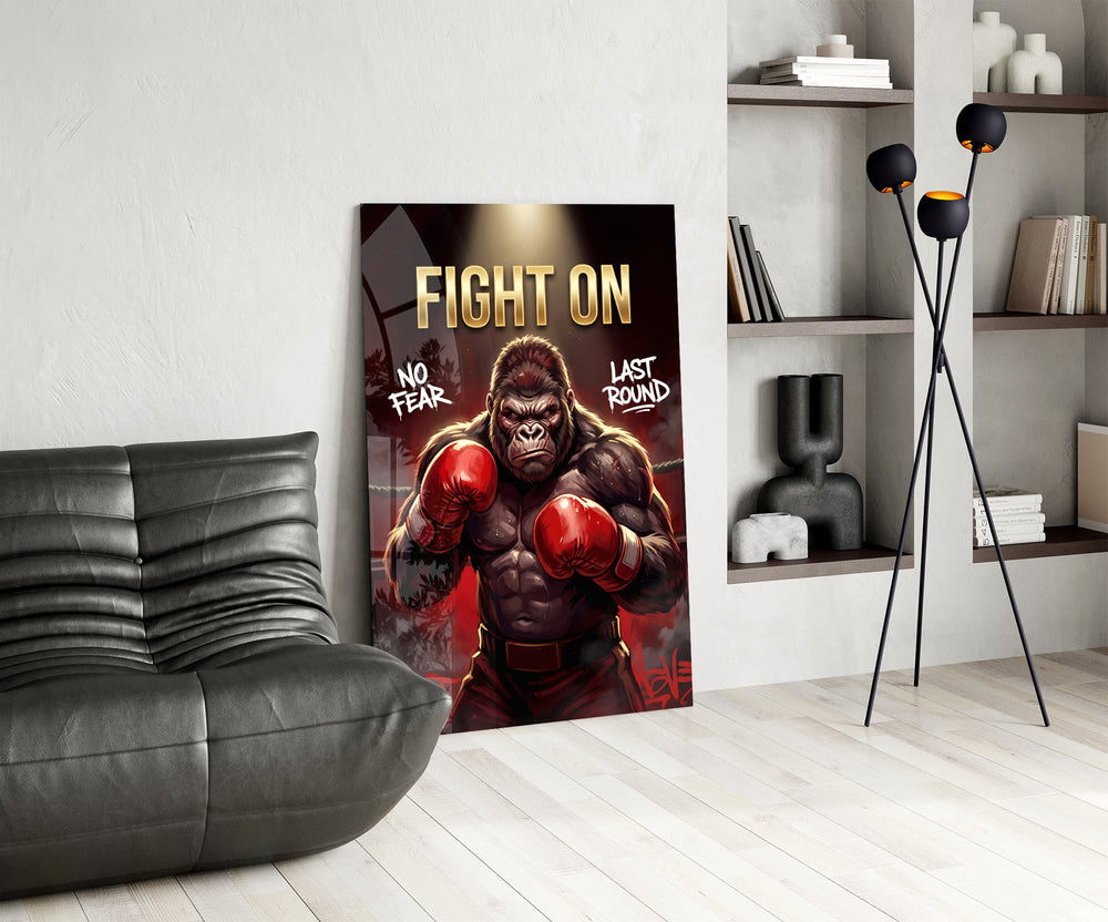 fight on gorilla boxer glass wall art leaning beside a dark leather sofa