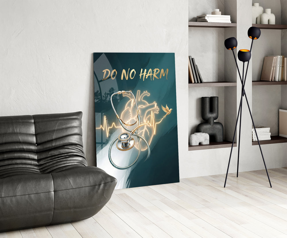 do no harm stethoscope and golden heart glass wall art leaning beside a dark leather sofa