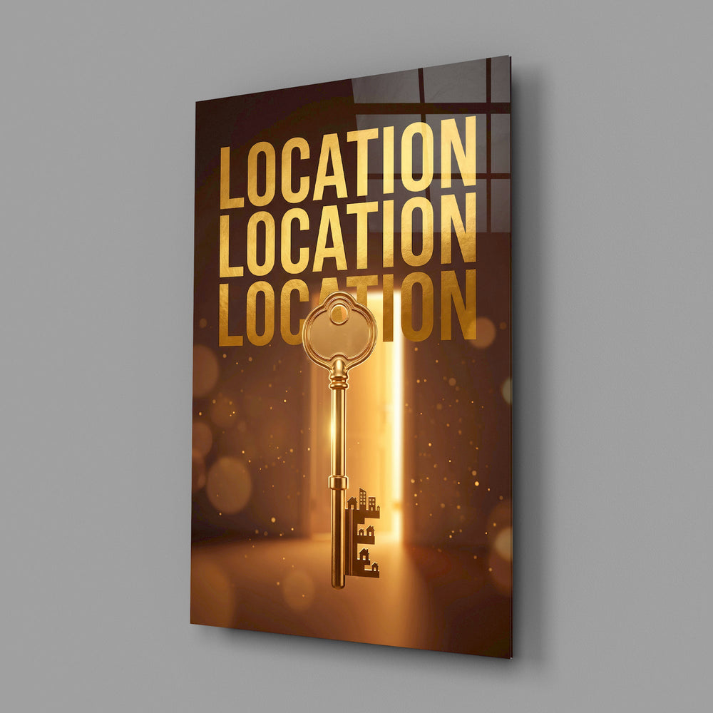 gold real estate key with a skyline glass wall art angled to show the polished tempered glass panel