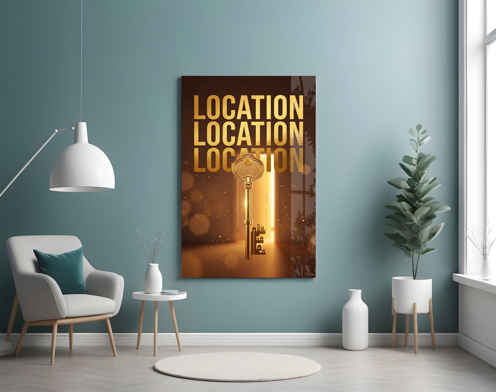 gold real estate key with a skyline glass wall art styled above an armchair in a reading corner
